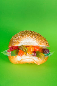 Close-up of lemon slice over green background