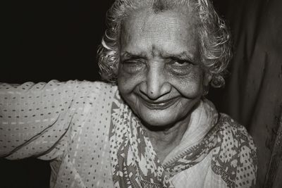 Close-up portrait of smiling senior woman