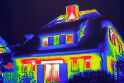 Low angle view of illuminated building against sky at night