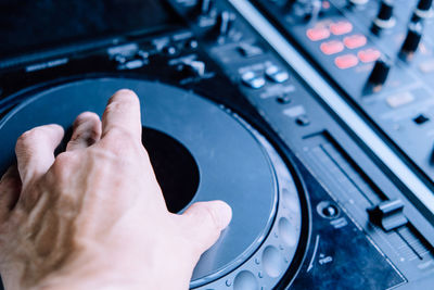 Close-up of cropped hand turntable