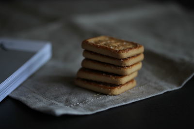 Close-up of biscuits on napkin at table