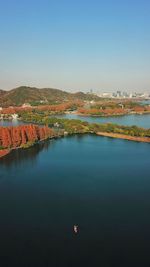 Scenic view of lake against clear blue sky