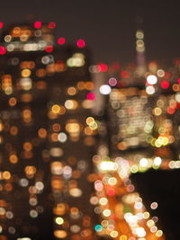 Defocused image of illuminated christmas tree at night