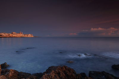 Scenic view of sea against sky at sunset