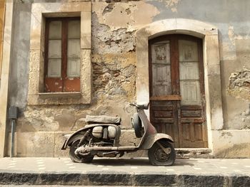 Vintage car outside house