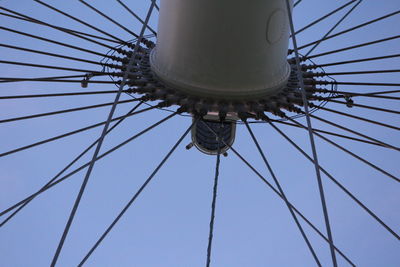 Low angle view of ferris wheel against blue sky