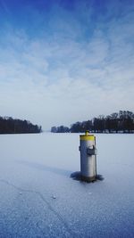 Lifeguard hut on snow against sky