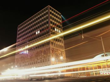 Low angle view of light trails at night