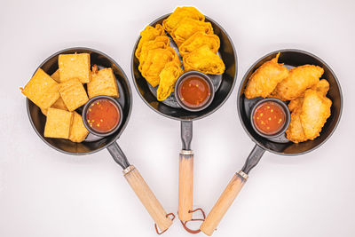 High angle view of food on table against white background