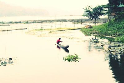 People on boat in lake