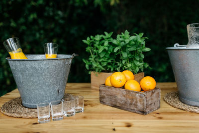 Close-up of drink in metallic bucket on table