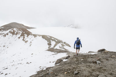 Ona man walks at the summit of iztaccihuatl volcano in mexico.