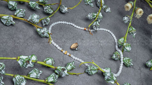 High angle view of heart shape on stone wall