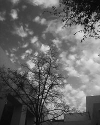 Low angle view of building against cloudy sky