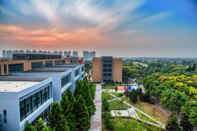 High angle view of buildings against sky during sunset