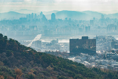 High angle view of buildings in city against sky