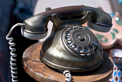 Close-up of old-fashioned telephone on table