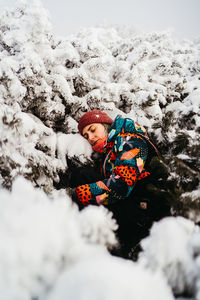 Side view of woman skiing on snow