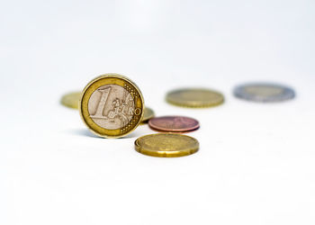 Close-up of coins on white background