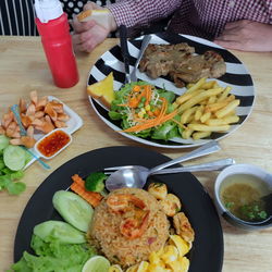 High angle view of person preparing food on table