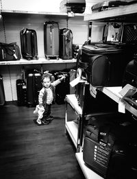 Full length of child on shelf