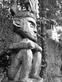 Low angle view of statue against temple