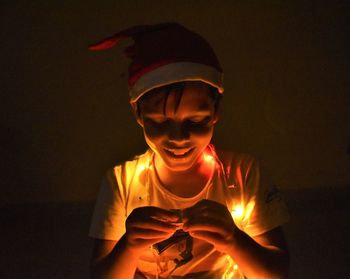 Portrait of boy holding camera