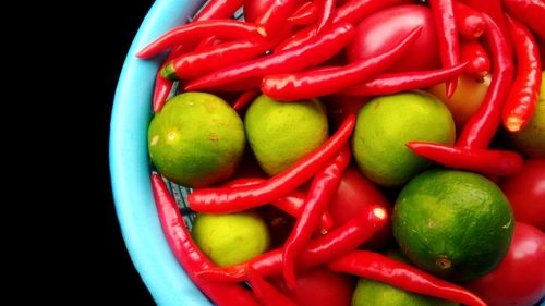 Close-up of red chili peppers in basket