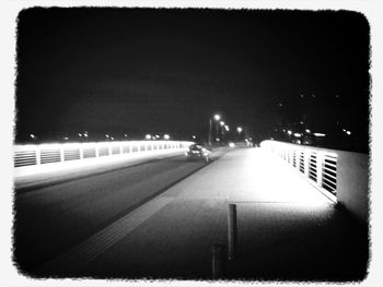 Illuminated road at night