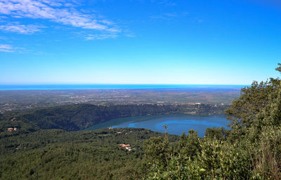 Scenic view of landscape against blue sky