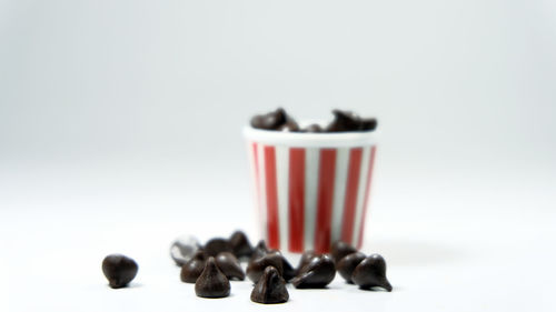 Close-up of coffee beans against white background