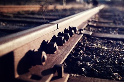 Close-up of nut and bolts on rusty railroad track