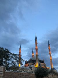 Low angle view of illuminated buildings against sky