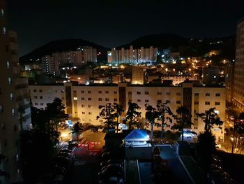 High angle view of illuminated buildings at night