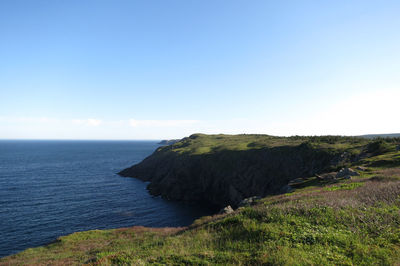 Scenic view of sea against blue sky