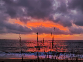 Scenic view of sea against dramatic sky