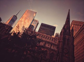 Low angle view of skyscrapers against sky