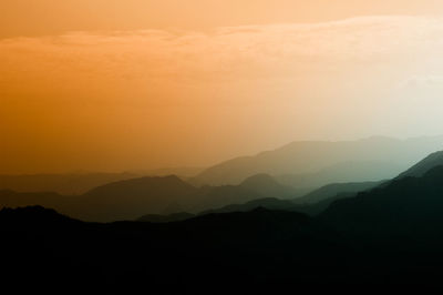 Scenic view of mountains at sunset