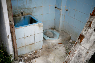 Damaged wall in bathroom