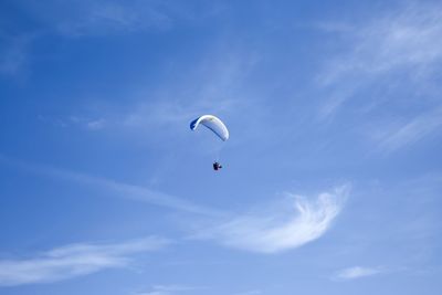 Low angle view of parachute against sky