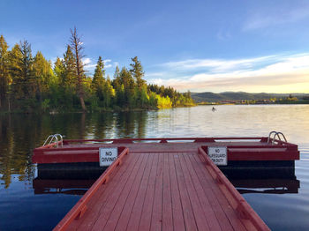 Pier over lake against sky