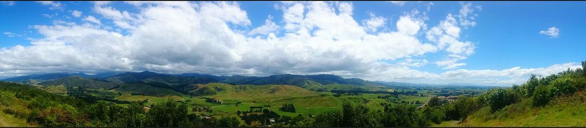 Scenic view of mountains against cloudy sky