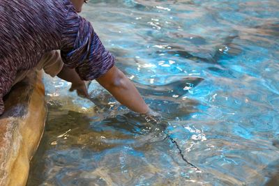 Man catching fish in water