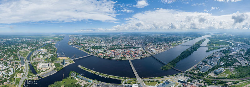Riga old town and dauguva river in foreground. drone point of view. latvia