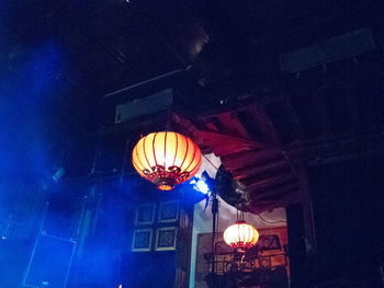 Low angle view of illuminated light bulb