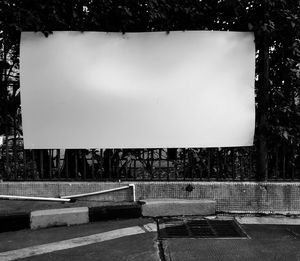 Empty benches against wall