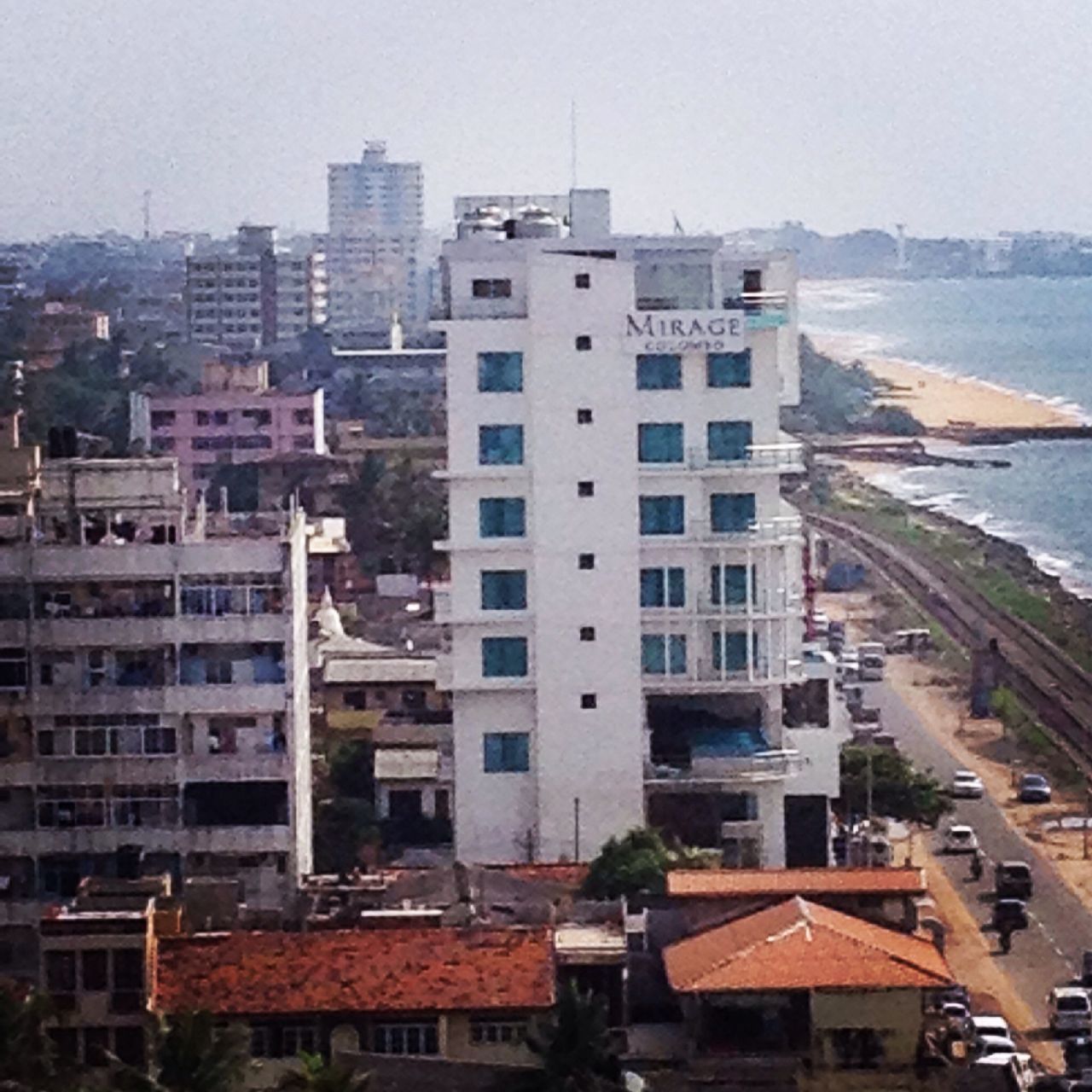 building exterior, architecture, built structure, city, cityscape, water, high angle view, residential building, residential district, residential structure, sea, crowded, sky, city life, transportation, building, house, river, outdoors, clear sky