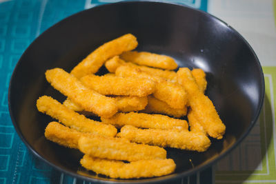 High angle view of french fries in bowl on table