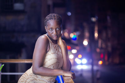 Beautiful lady posing on neon light