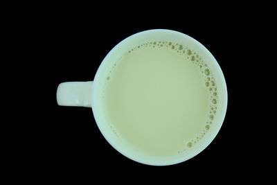 Close-up of drink over black background